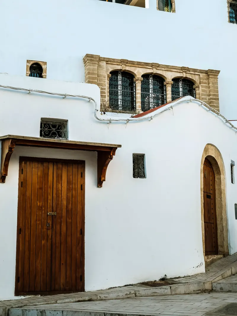 Wooden doors on a white street of the Medina